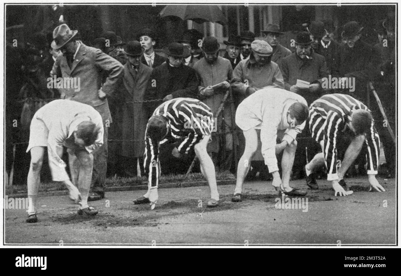 Athletics - Oxford and Cambridge Jubilee Meeting - digging to get a foothold at the start line of the quarter-mile race, won by Gordon Davies of Cambridge in 51sec. Stock Photo