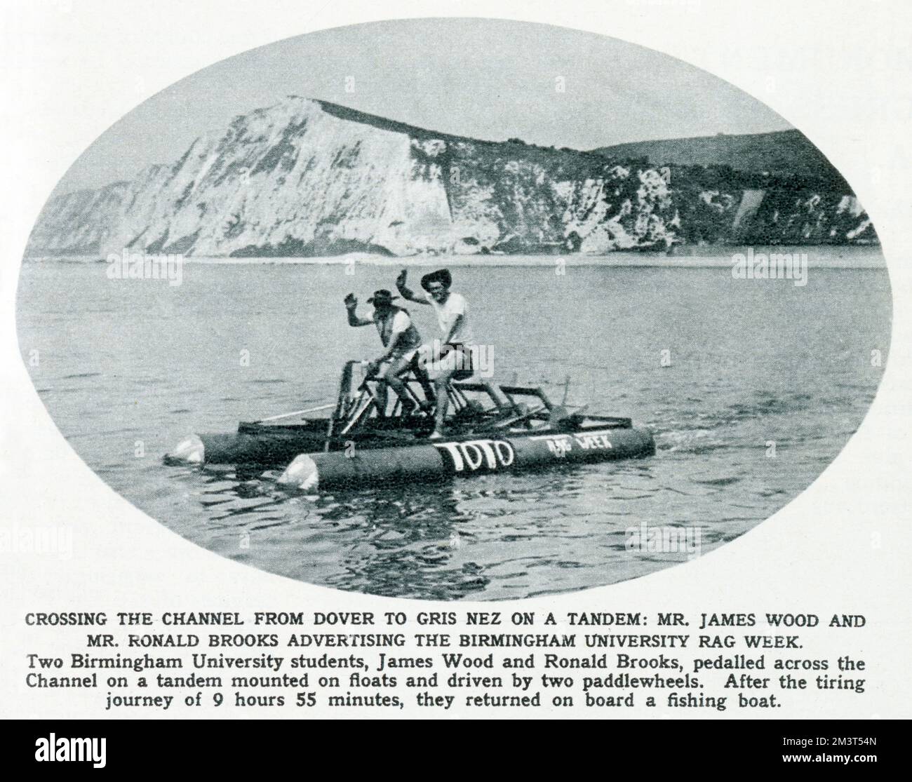 James Wood and Ronald Brooks, two students at the University of Birmingham, pedalling across the Channel from Dover to Gris Nez by way of a tandem bike mounted on floats, all in the cause of Rag Week. The journey took them 9 hours 55 minutes. Stock Photo