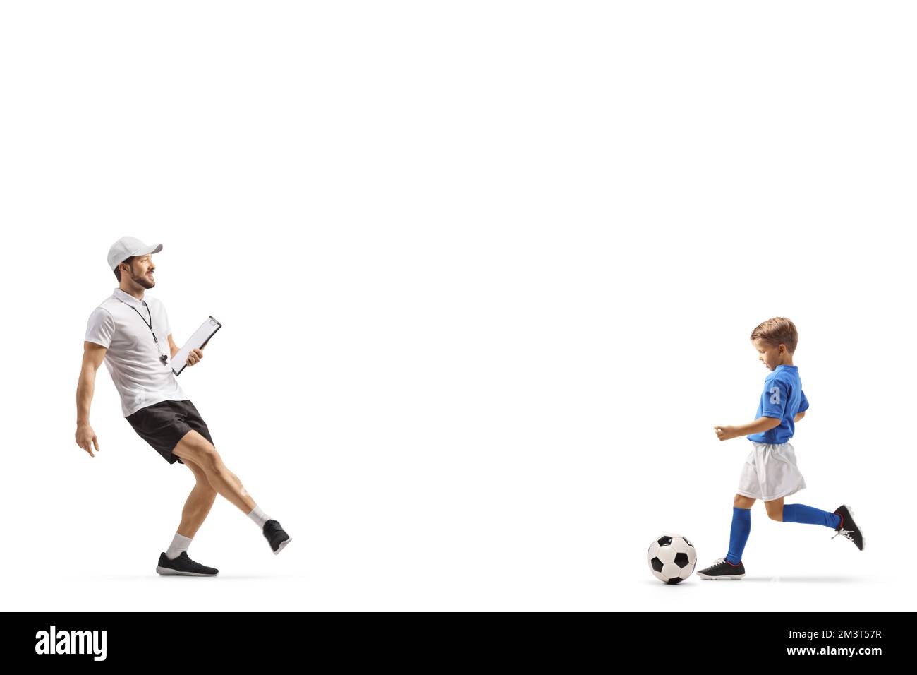 Football coach praticing ball kick with a boy isolated on white