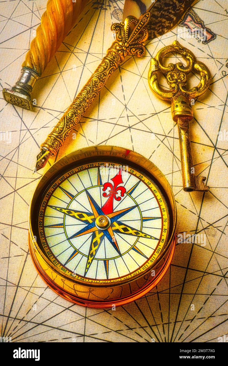 Golden Compass And Key Stock Photo Alamy