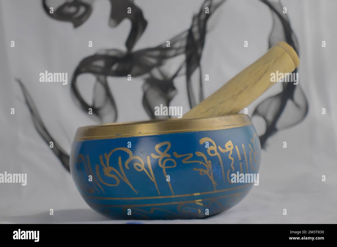 Hand Crafted bronze Indian Singing Bowl painted in Blue and Gold color, often used in Hindu