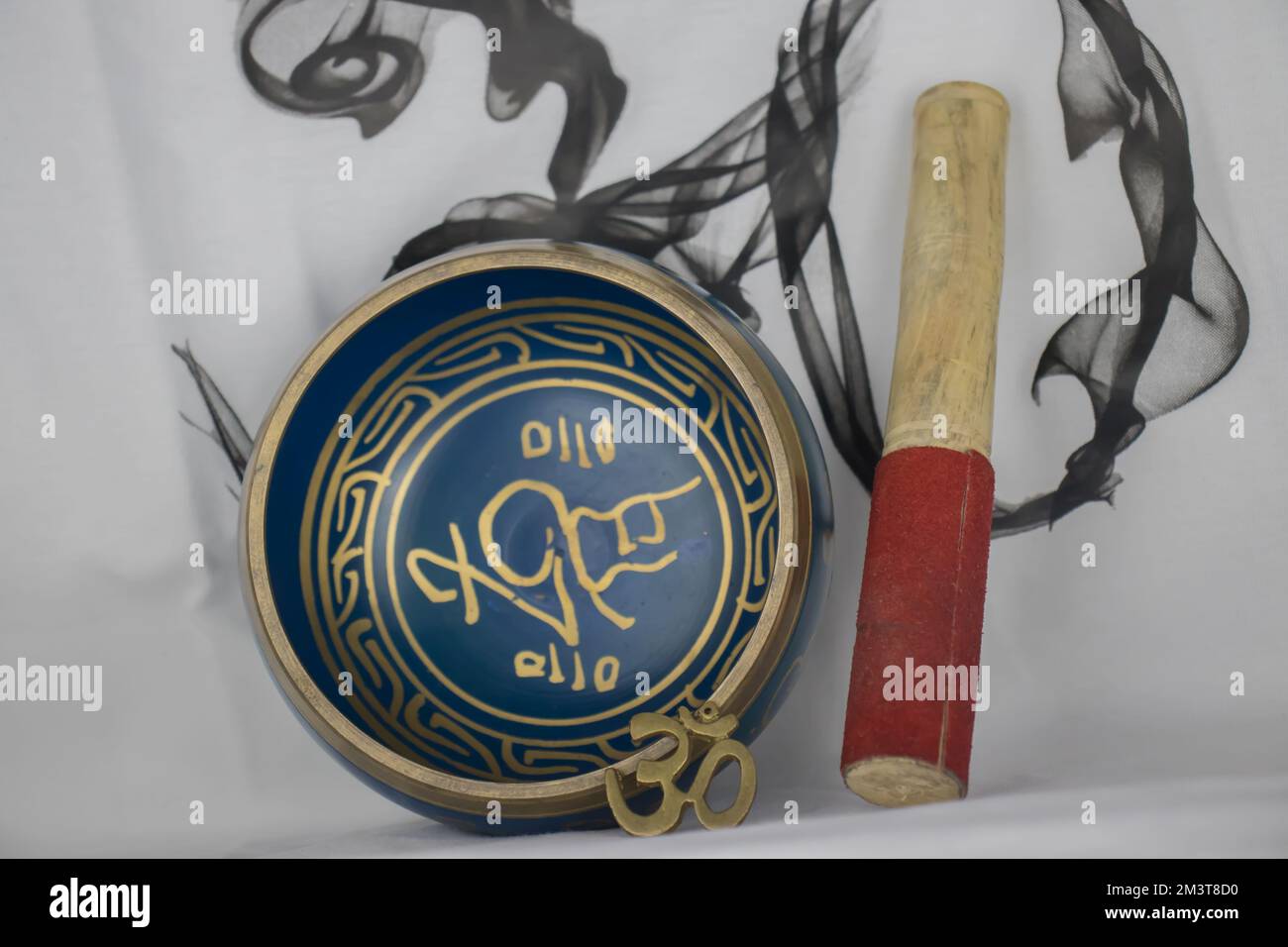 Hand Crafted bronze Indian Singing Bowl painted in Blue and Gold color, often used in Hindu