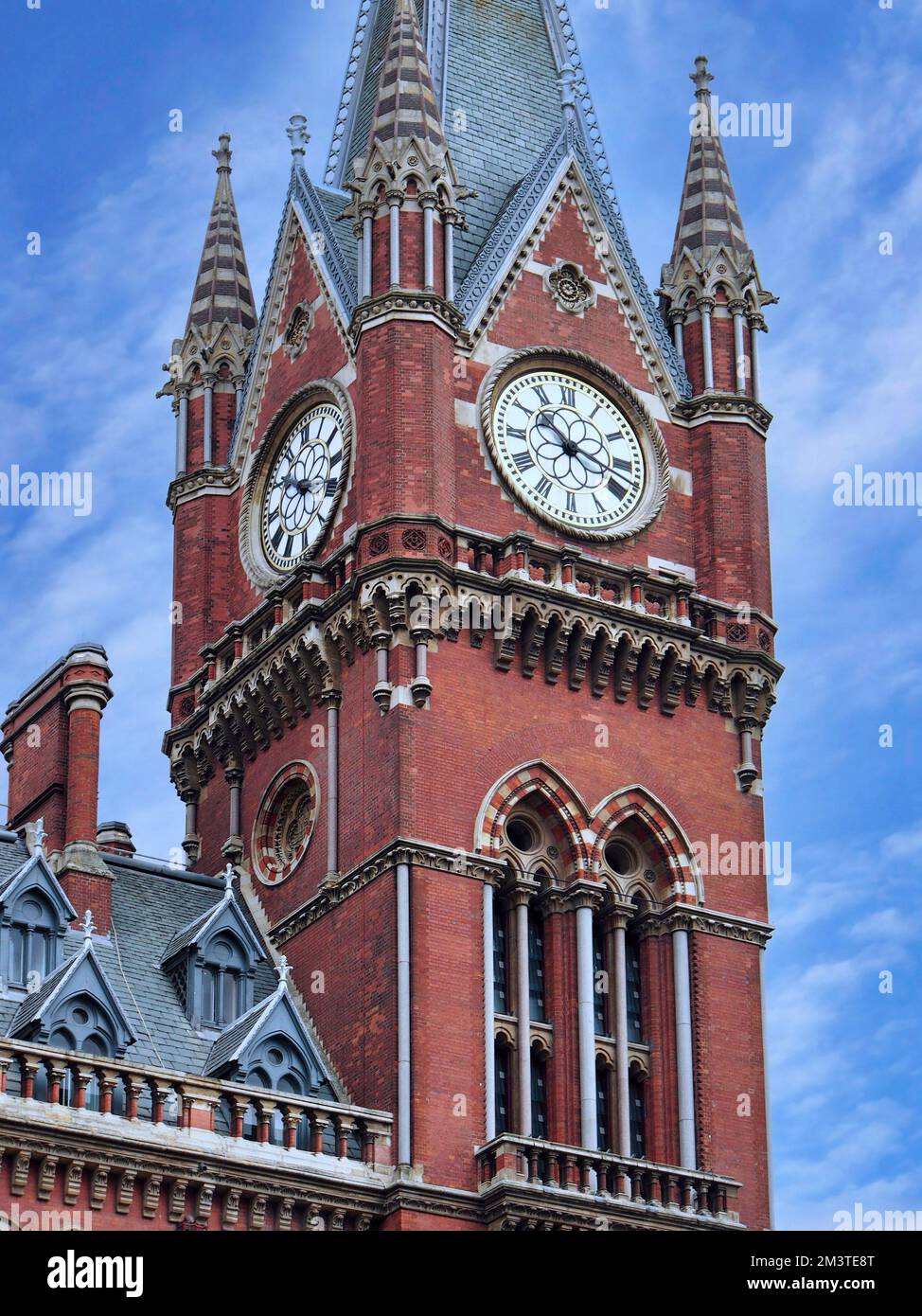 Clock tower of historic St. Pancras railway station, London, Victorian gothic architecture Stock