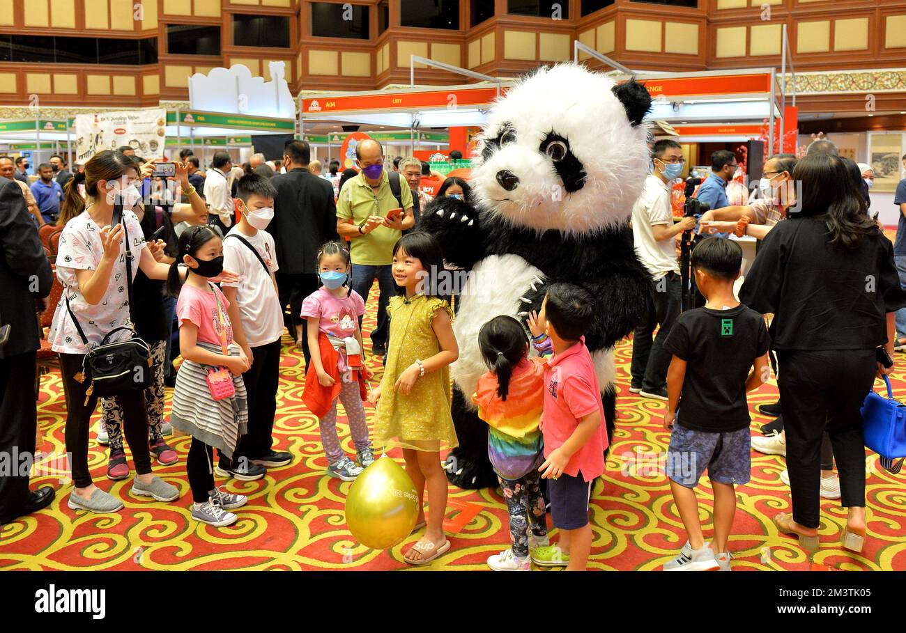 Bandar Seri Begawan, Brunei. 16th Dec, 2022. Children pose with a panda