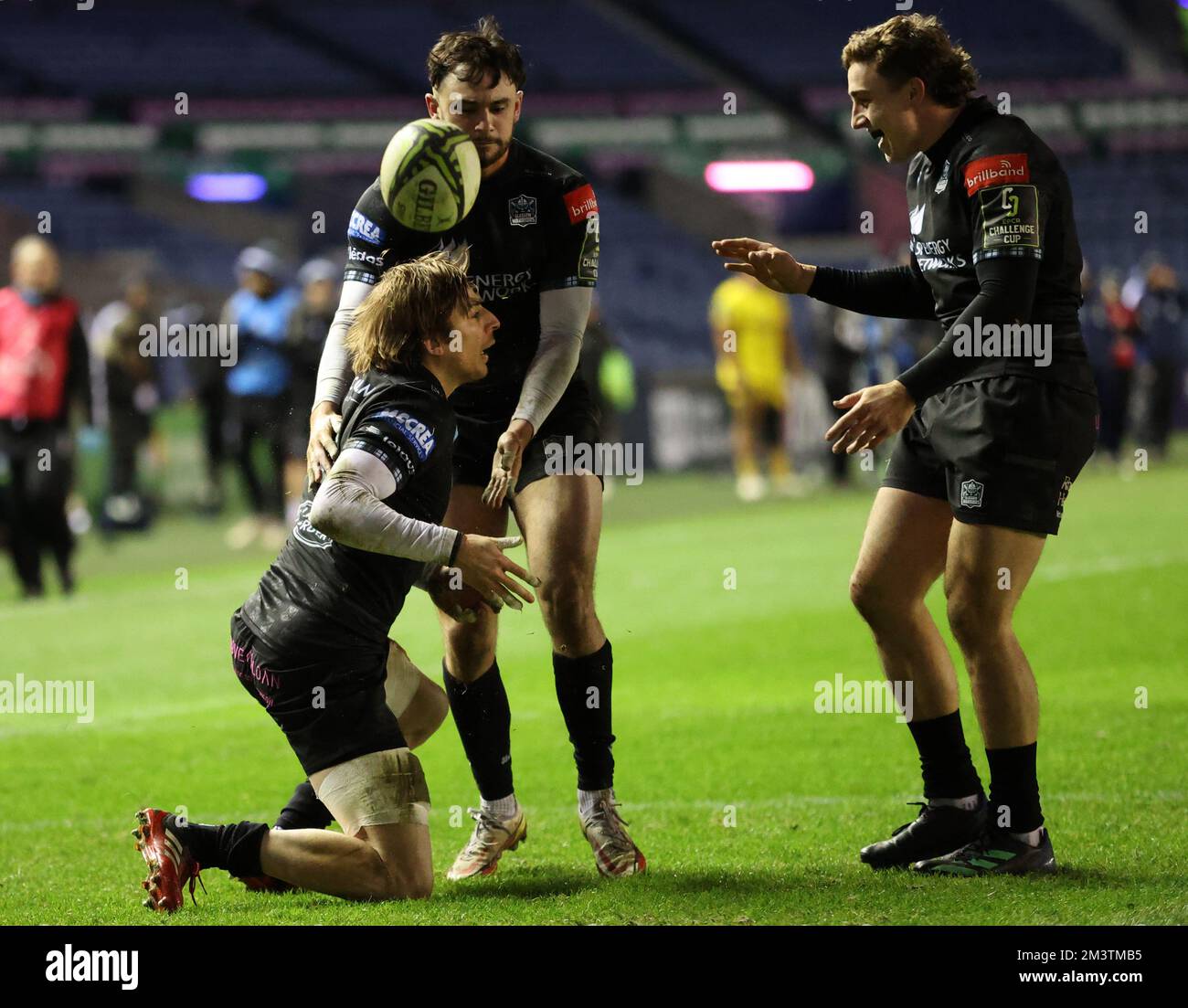 Glasgow Warriors Sebastian Cancelliere celebrates his try with Ali Price and Josh McKay during the EPCR Challenge Cup match at BT Murrayfield Stadium, Edinburgh. Picture date: Friday December 16, 2022. Stock Photo