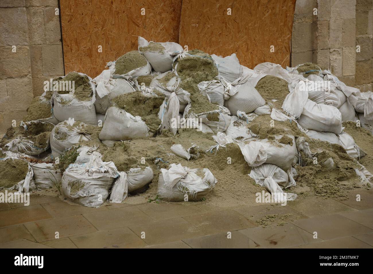 Texture of broken barricade wall made of white sandbags for war