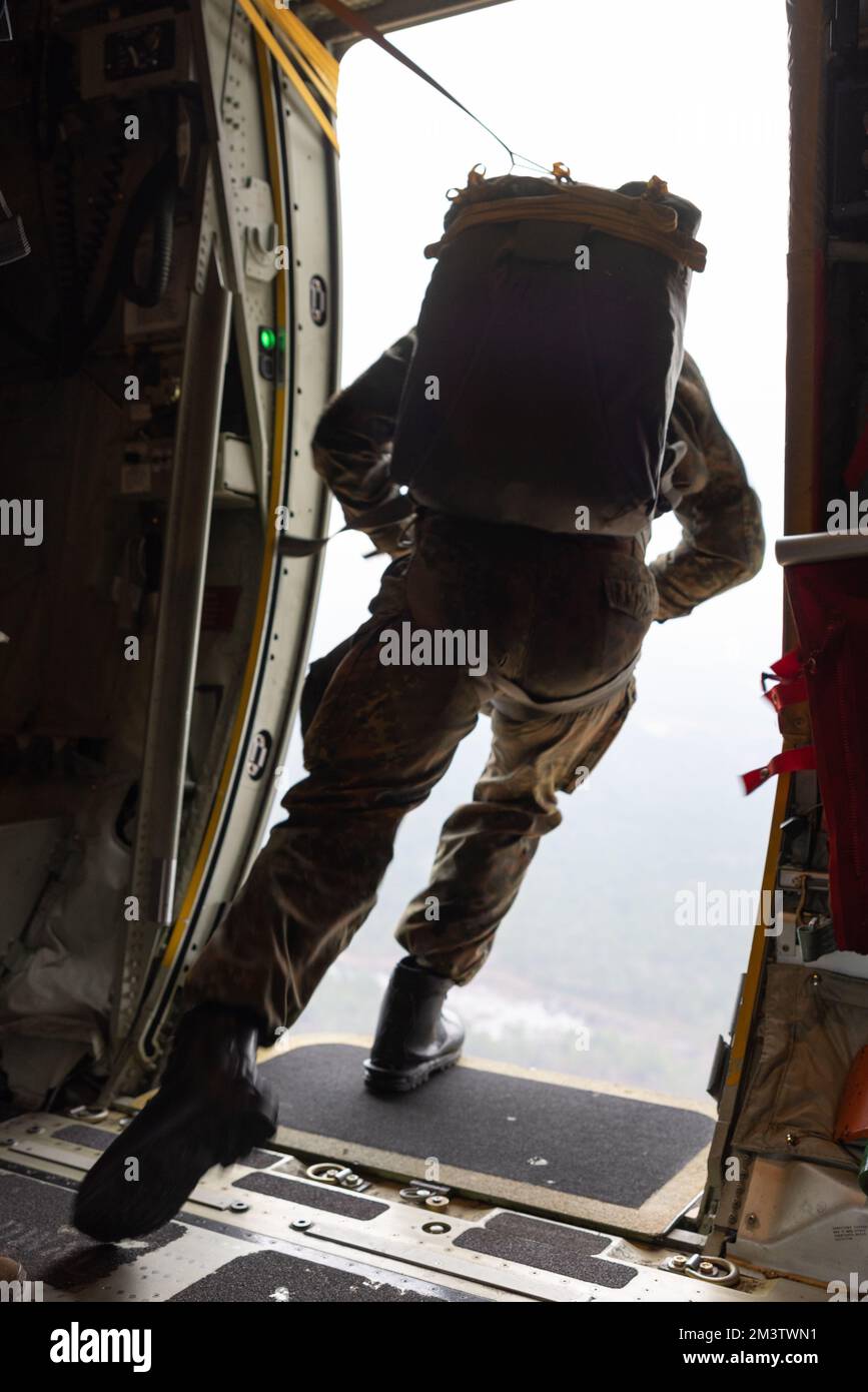 A U.S. Soldier jumps out of a KC-130J Hercules assigned to Marine Aerial Refueler Transport Squadron (VMGR) 252 near Fort Bragg, North Carolina, Dec. 7, 2022. Randy Oler Memorial Operation Toy Drop 2.0 is an event hosted by the U.S. Army Civil Affairs and Psychological Operations Command (Airborne) in conjunction with Fort Bragg and partner nations’ airborne organizations to increase joint-airborne interoperability and conduct community outreach. VMGR-252 is a subordinate unit of 2nd Marine Aircraft Wing, the aviation combat element of II Marine Expeditionary Force. (U.S. Marine Corps photo by Stock Photo