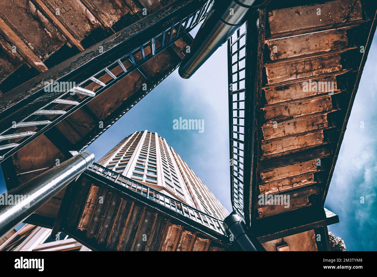 Looking up at a building through stairs in Chicago Stock Photo