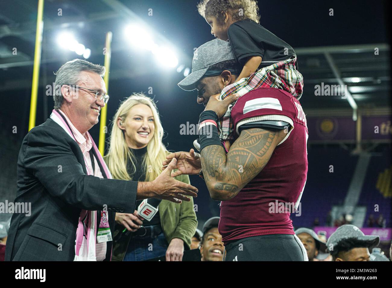 Orlando, Florida, USA, December 16, 2022,  Troy Trojans player Devonte Ross #7 receives the MVP trophy after wiining the Duluth Cure Bowl at Exploria Stadium.  (Photo Credit:  Marty Jean-Louis) Stock Photo