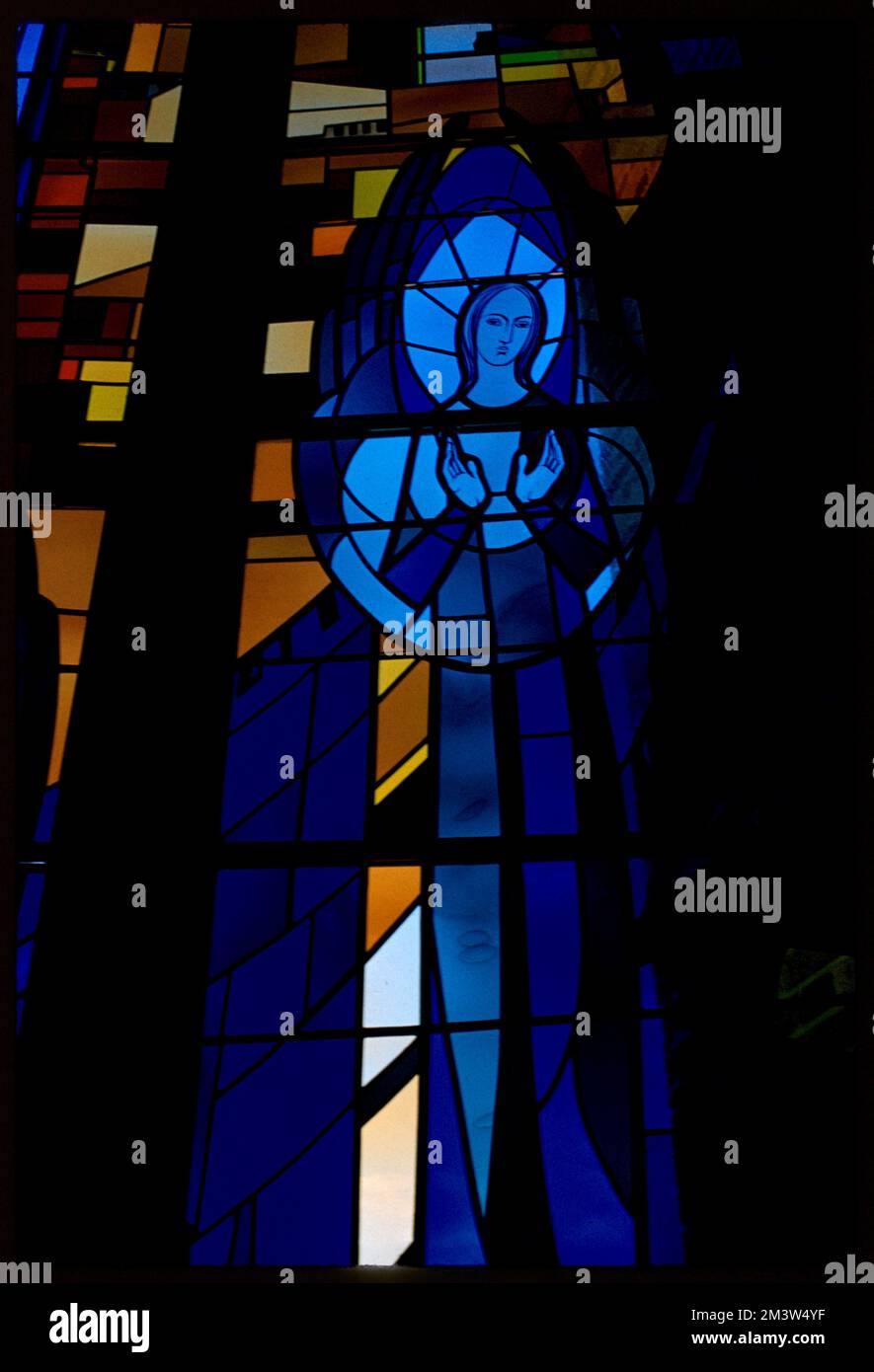 Stained glass window depicting woman, possibly Virgin Mary , Stained