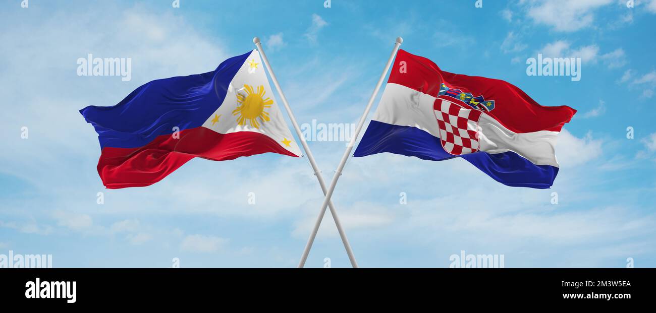 two crossed flags Croatia and Philippines waving in wind at cloudy sky ...