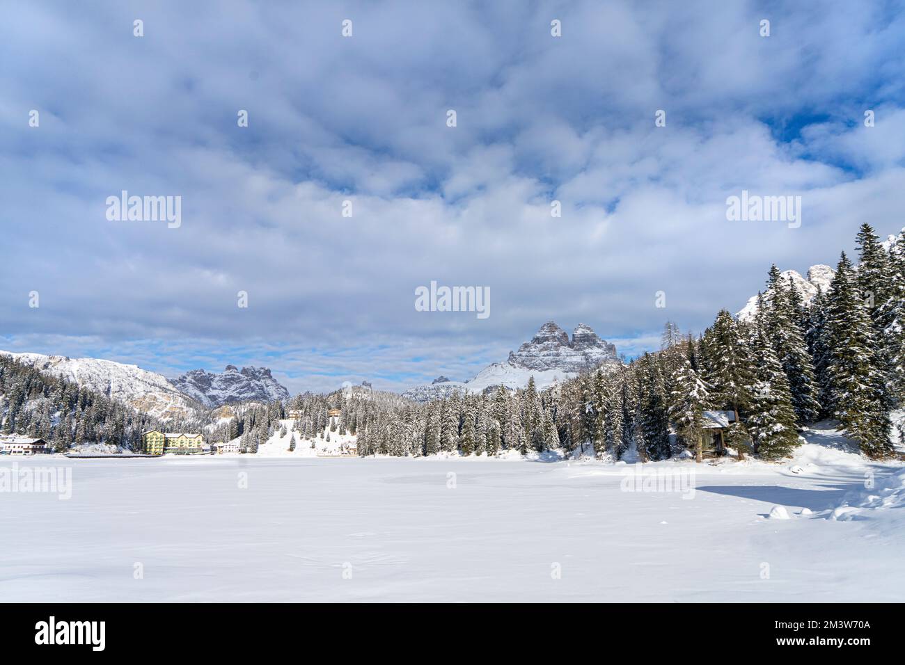 panoramic view of the frozen Misurina lake, in the Dolomites mountains, Italy, in winter Stock Photo