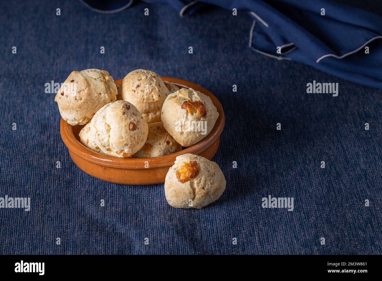 Bowl with chipa, typical Paraguayan cheese bread with copy space. Stock Photo