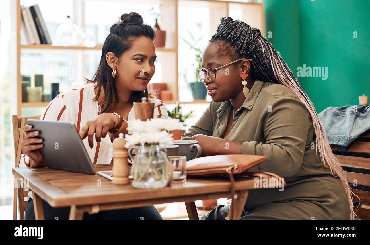 Now thats a good article. two young women using a digital tablet ...