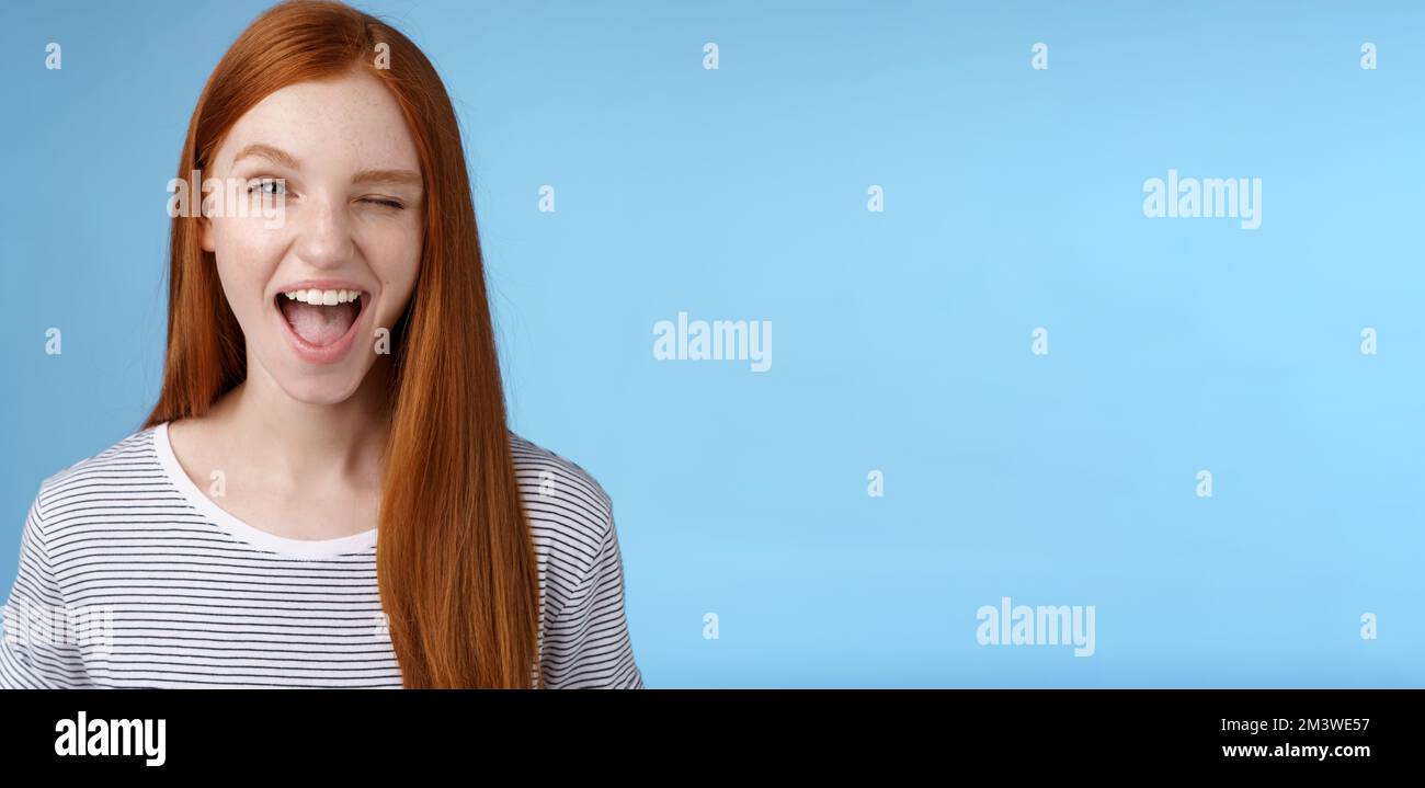 Cheeky good-looking flirty young gorgeous redhead girlfriend winking ...
