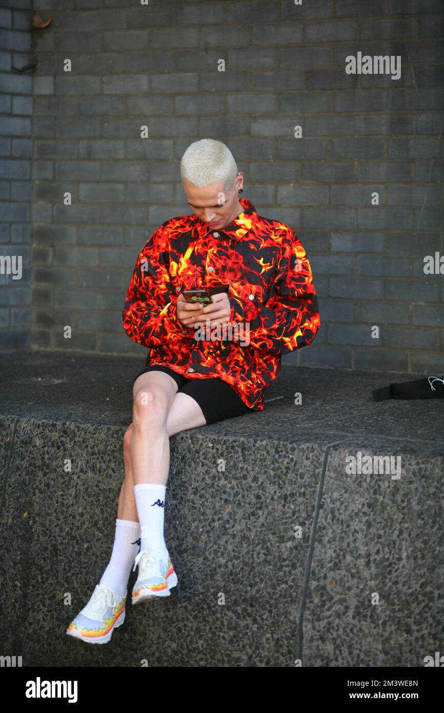 Stylish young man at London Fashion Week wearing cool street style