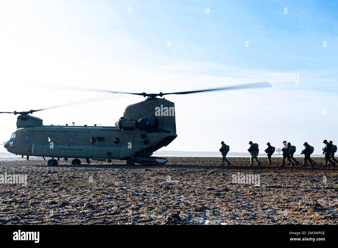 December 13, 2022 - Rheinland-Pfalz, Germany - Jumpers board a 214th Aviation Regiment Boeing CH-47 Chinook helicopter prior to a parachute jump at Alzey drop zone in Ober-FlÃ¶rsheim, Germany, December. 13, 2022. U.S. Army Soldiers from 214th AVN, U.S. Air Force Airmen from the 435th Contingency Squadron based at Ramstein Air Base, Germany, and partner and allied nations trained to become more proficient parachutists and strengthen their partnership in the pursuit of providing air and ground support wherever it may be needed. Allied forces in Europe regularly train together to ensure timely Stock Photo