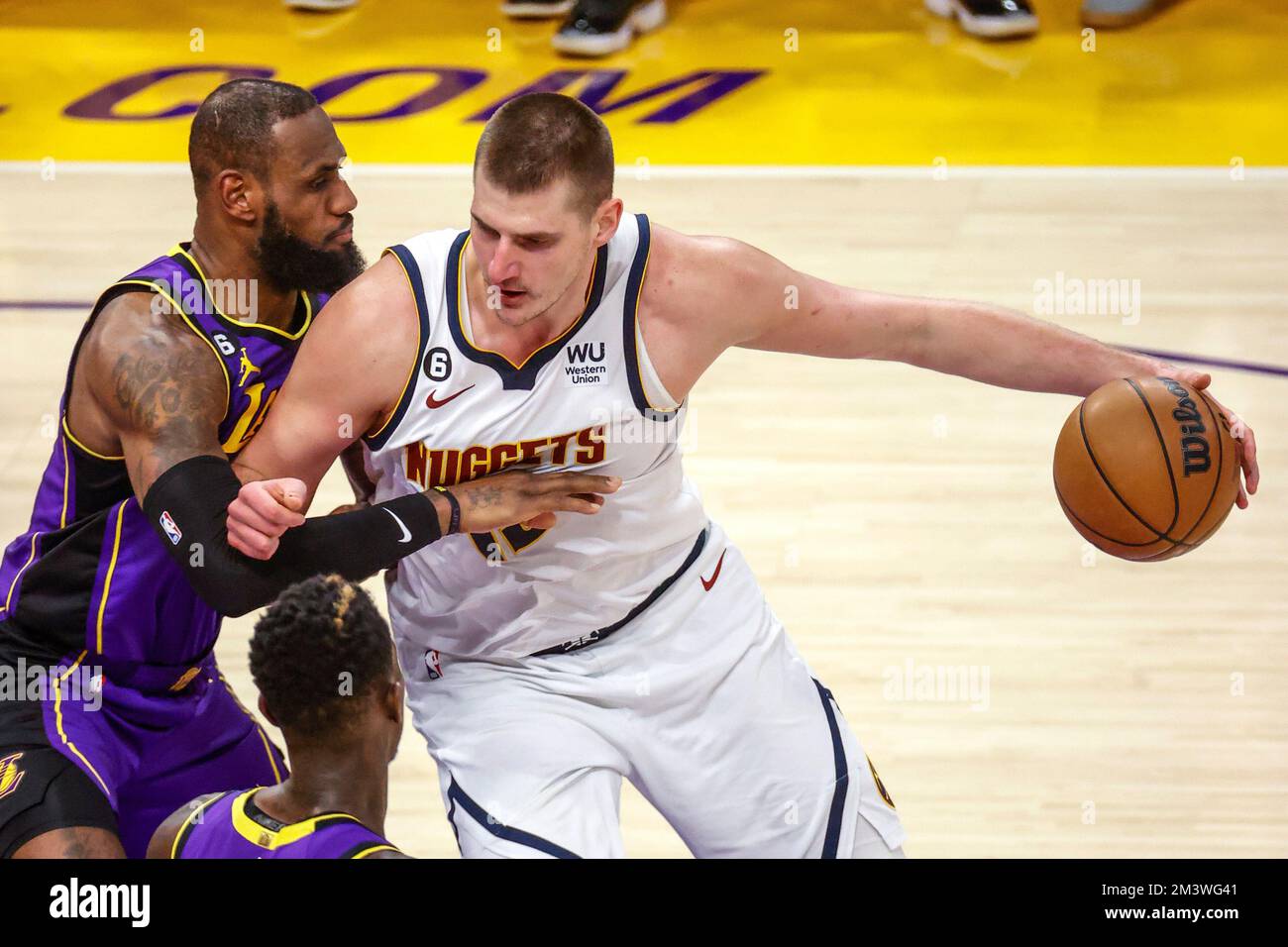 Los Angeles, California, USA. 16th Dec, 2022. Denver Nuggets center Nikola Jokic (15) is defended by Los Angeles Lakers forward LeBron James (6) during an NBA basketball game, Friday, Dec. 16, 2022, in Los Angeles. (Credit Image: © Ringo Chiu/ZUMA Press Wire) Stock Photo