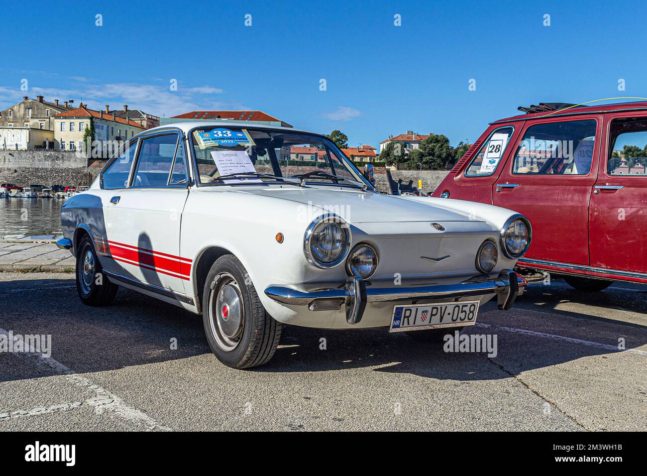 A vintage old-timer, the Italian Fiat 850 sport coupe from 1968 outdoors in sunny weather Stock Photo