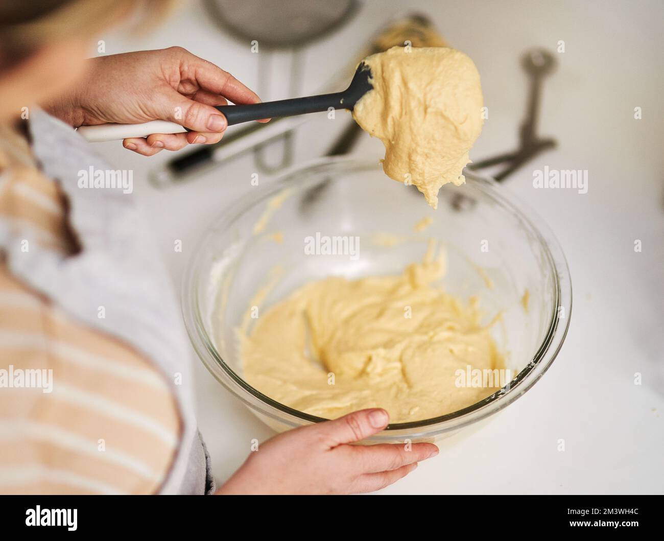This batter is ready to use. an unrecognizable woman mixing batter in a ...