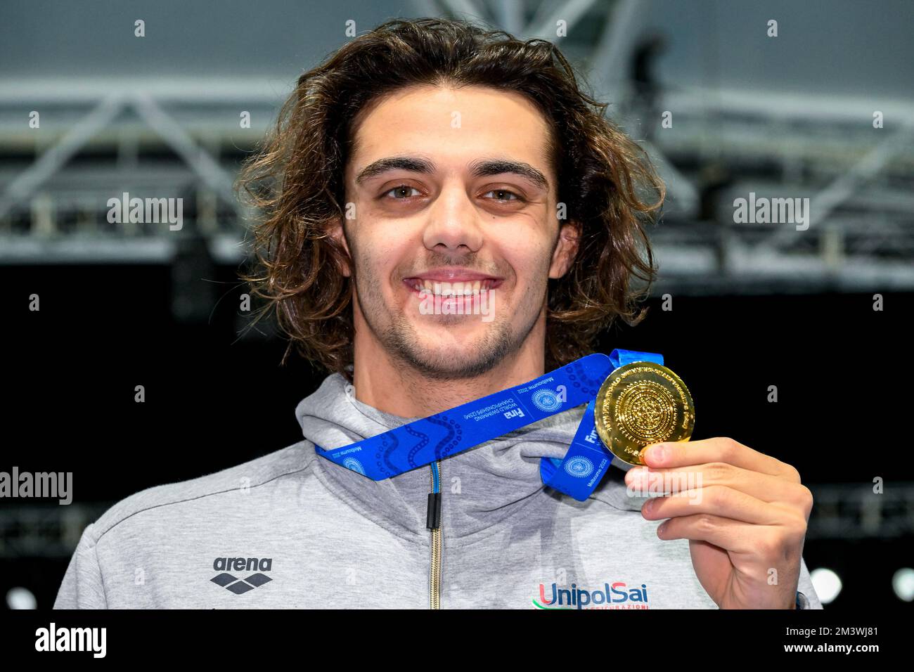 Thomas Ceccon of Italy shows the gold medal after compete in the 100m Individual Medley Men Final during the FINA Swimming Short Course World Champion Stock Photo