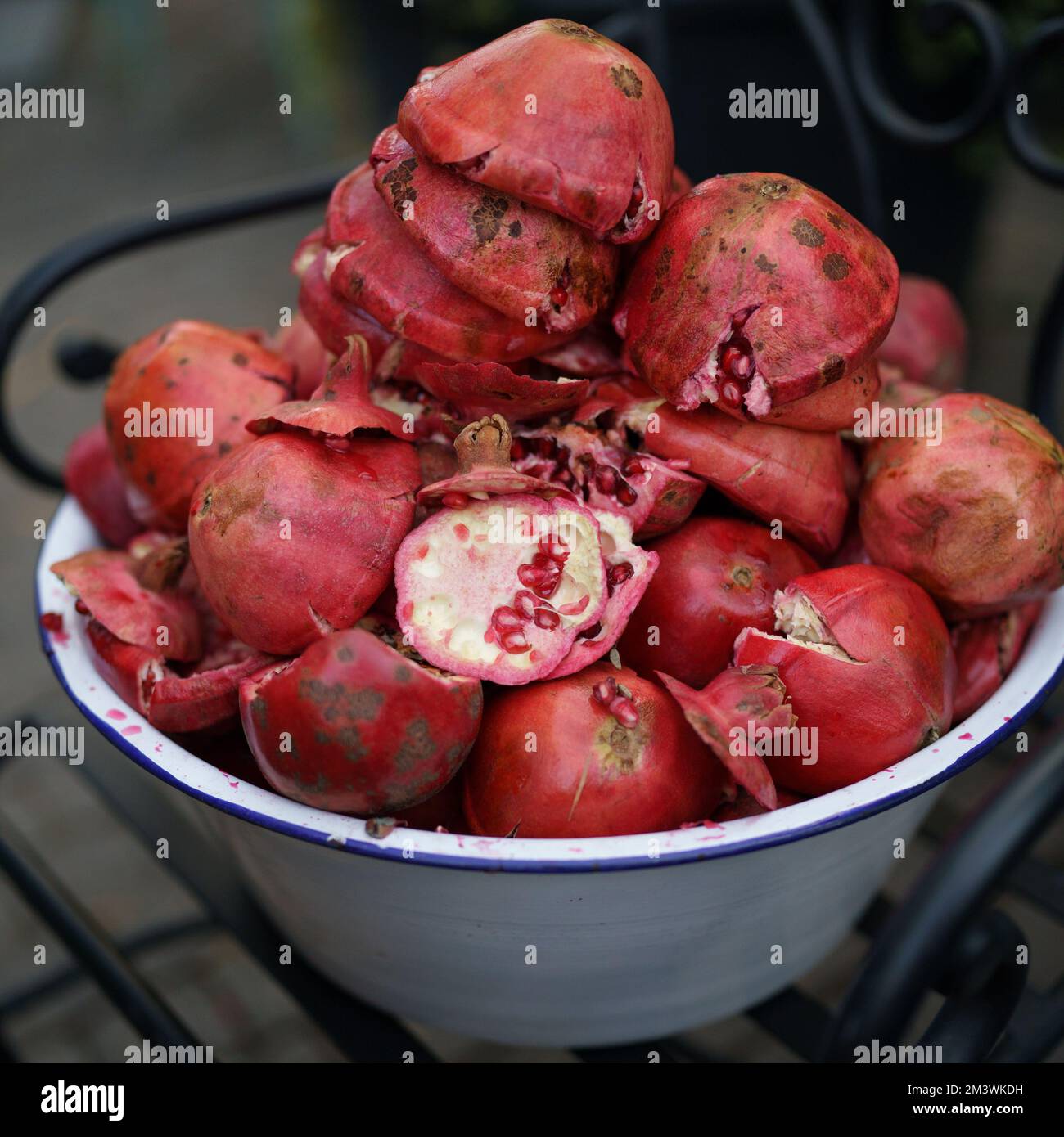 Waste from pomegranate fruit without grains in enamel bowl after