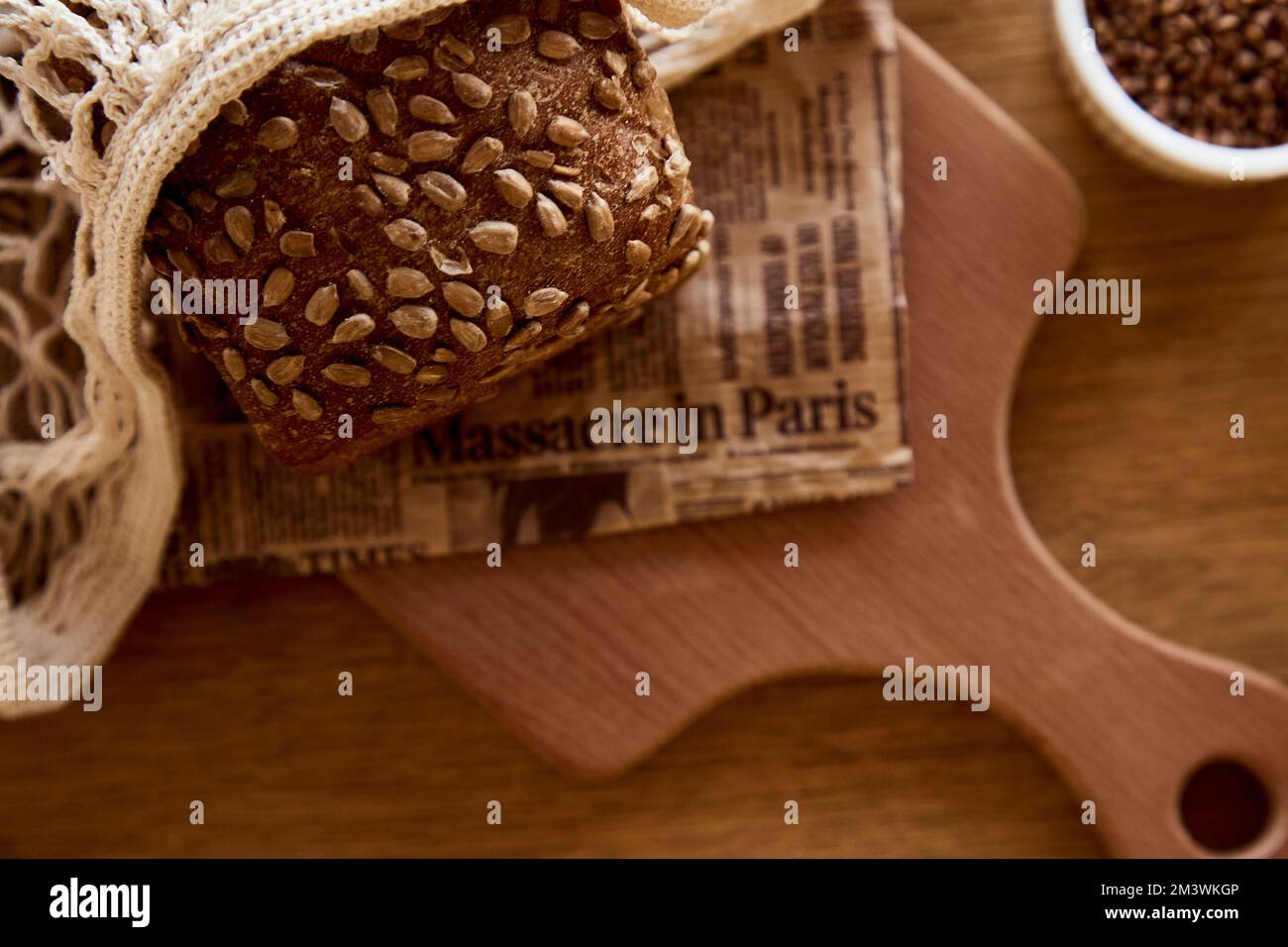 Buckwheat unleavened bread with sunflower seeds in eco mesh close up