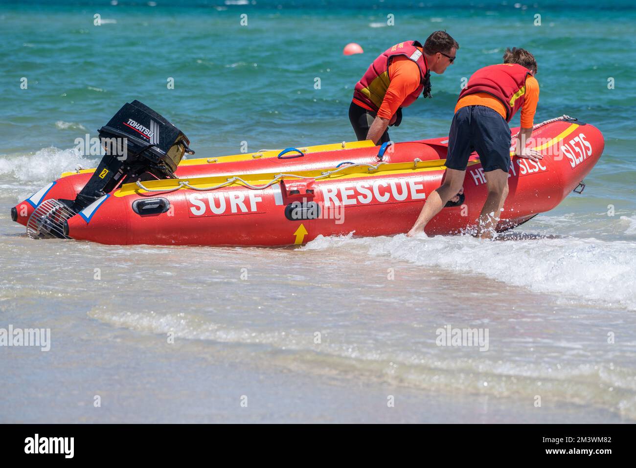Adelaide, Australia. 17 December 2022. Surf rescue volunteers push a