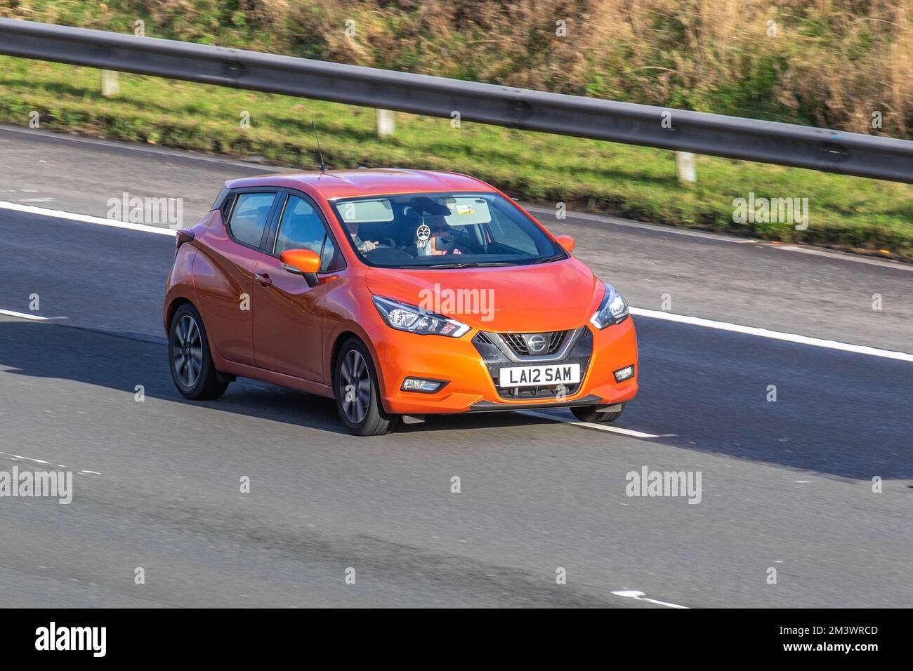 2018 Orange NISSAN MICRA IG-T ACENTA LIMITED EDITION 898cc 5 speed manual; travelling on the M6 motorway, UK Stock Photo