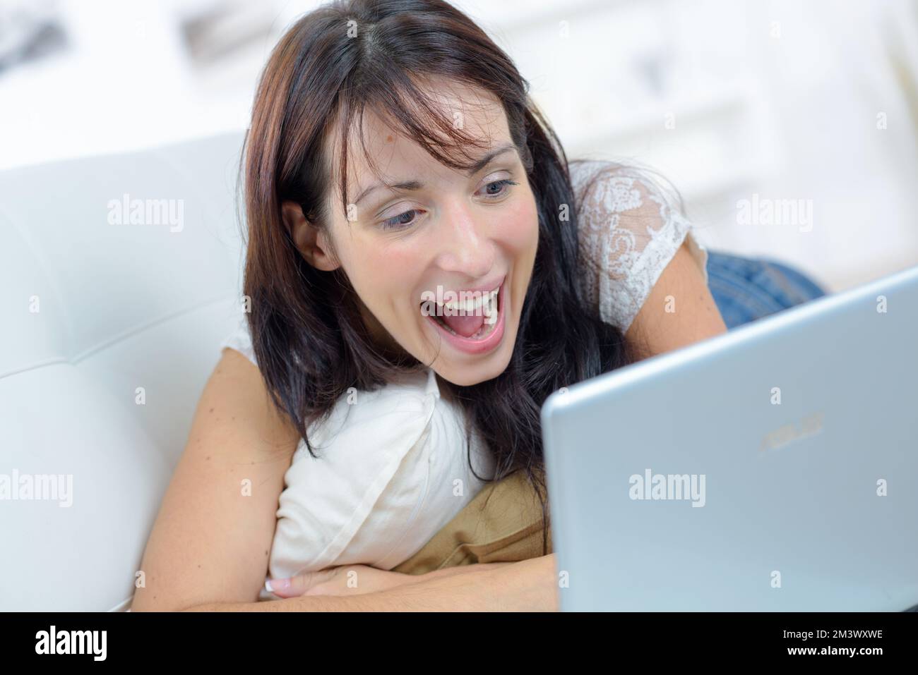 a happy woman with laptop Stock Photo