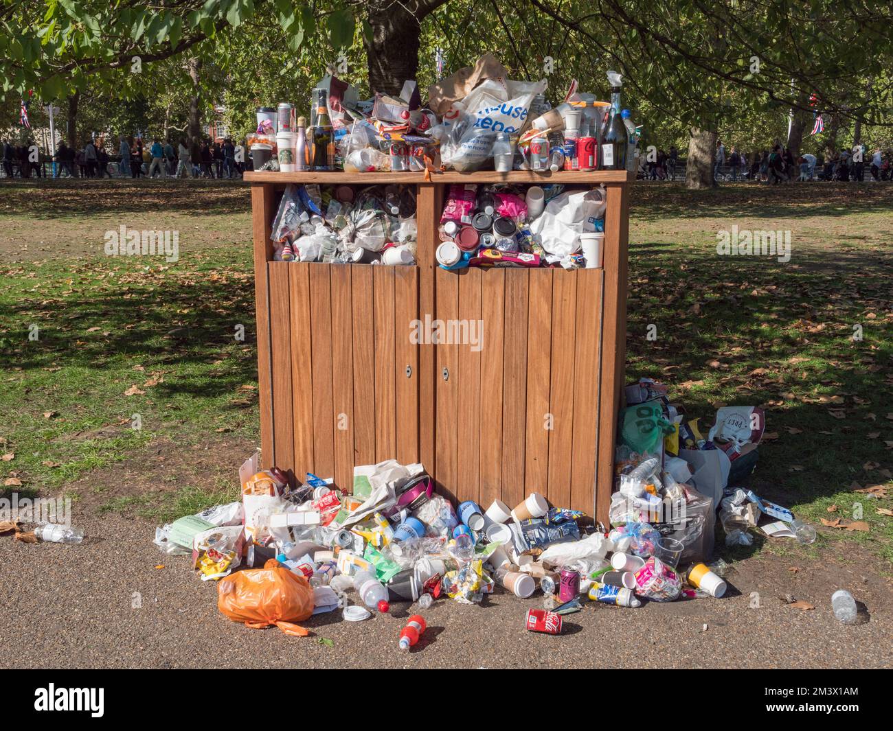 Overflowing public rubbish bins in St James Park, London, UK Stock