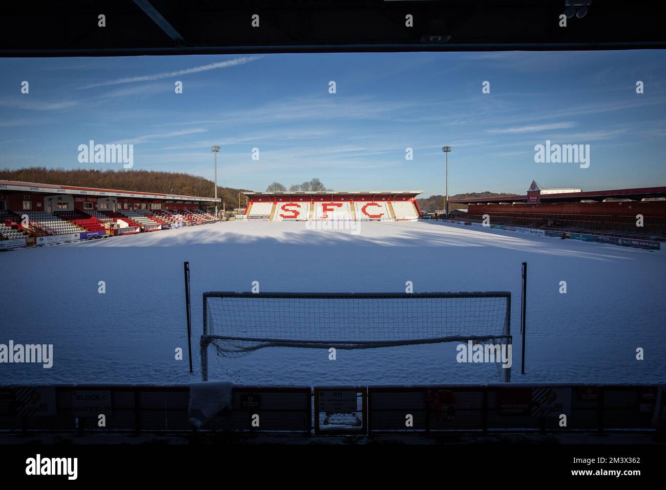 Snow covered football / soccer pitch in wintery scene at English football ground. Lamex Stadium, Stevenage FC, Stock Photo