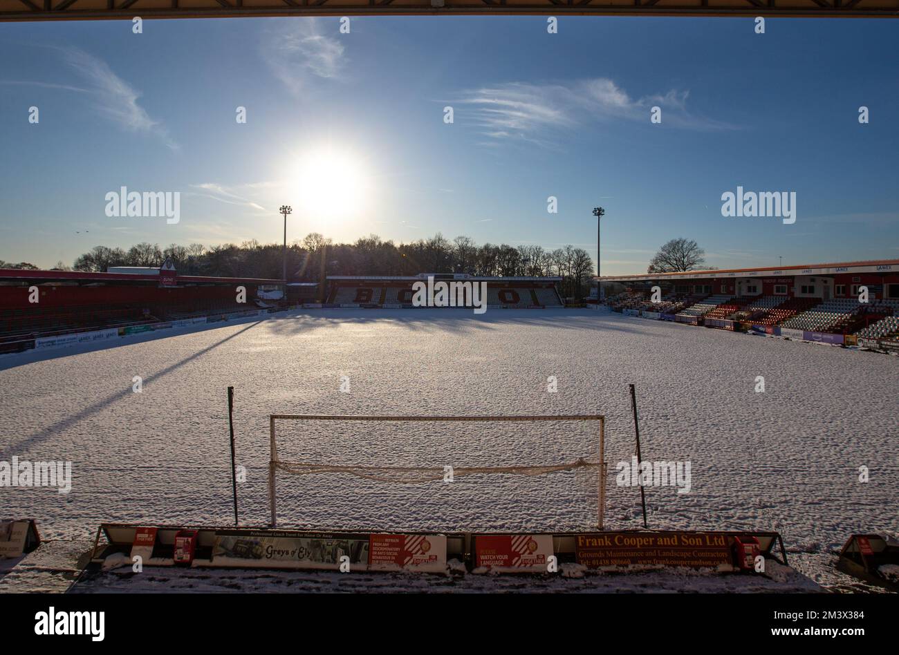 Snow covered football / soccer pitch in wintery scene at English football ground. Lamex Stadium, Stevenage FC, Stock Photo