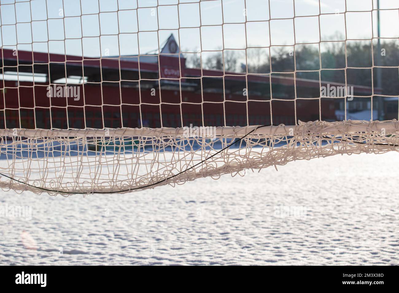 Snow covered football / soccer pitch in wintery scene at English football ground. Lamex Stadium, Stevenage FC, Stock Photo