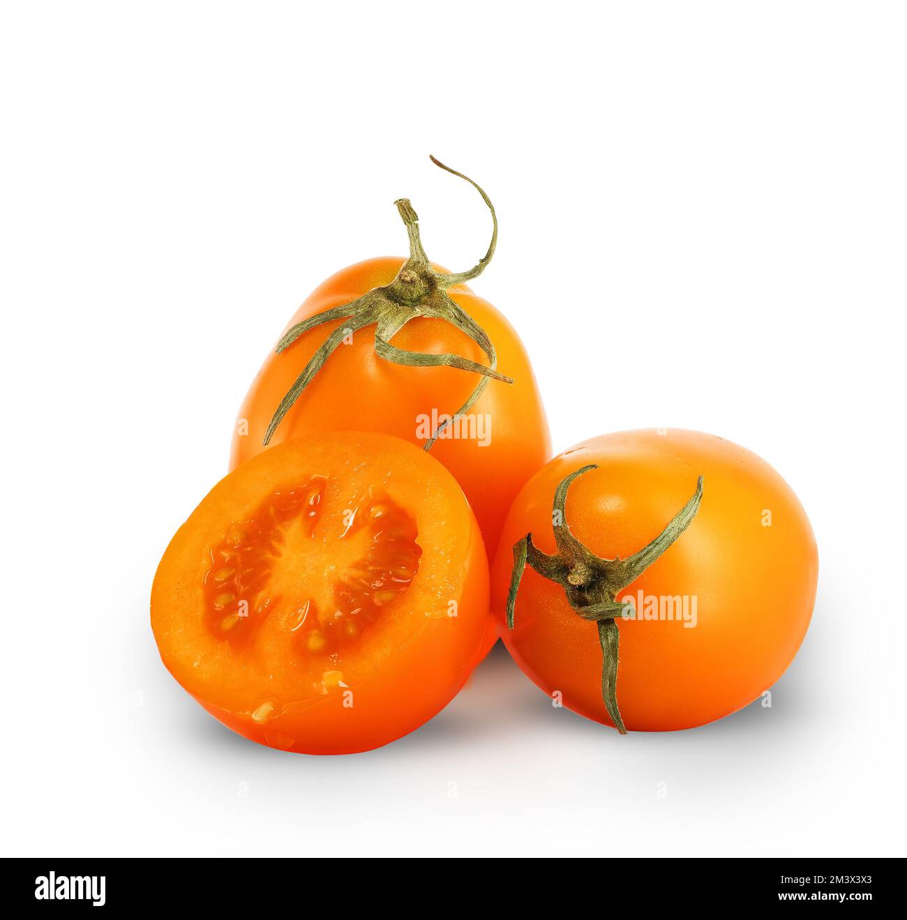three yellow tomatoes on a white background Stock Photo
