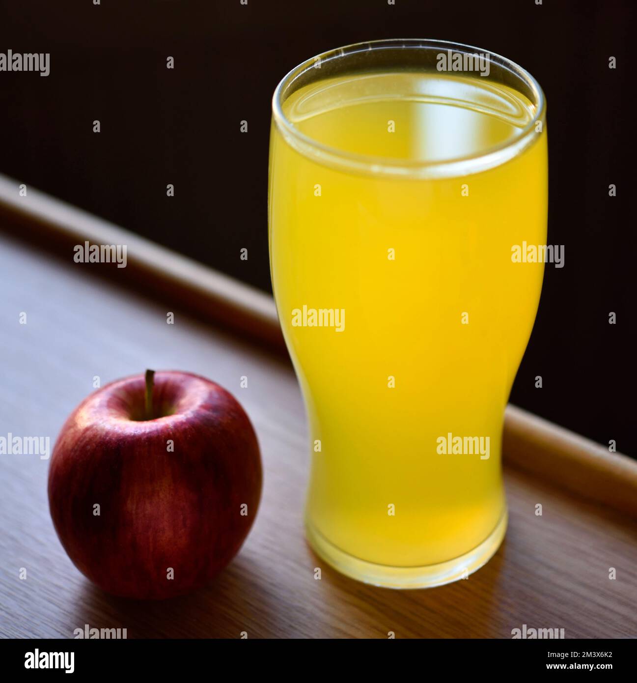 Glass of orange juice and apple Stock Photo
