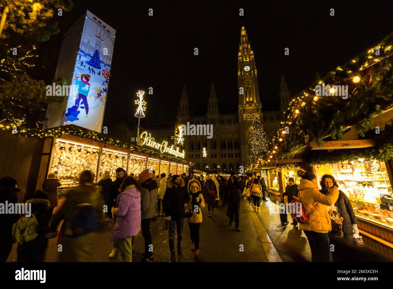 People visiting Wiener Christkindlmarkt, Rathaus Platz (City Hall Square), Vienna, Austria Stock Photo