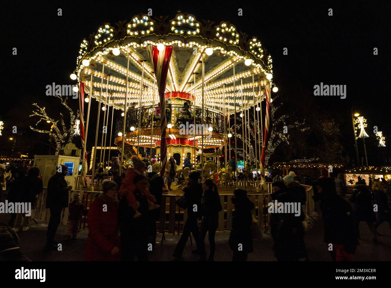 Traditional merry-go-round at Wiener Christkindlmarkt, Rathaus Platz (City Hall Square), Vienna, Austria Stock Photo