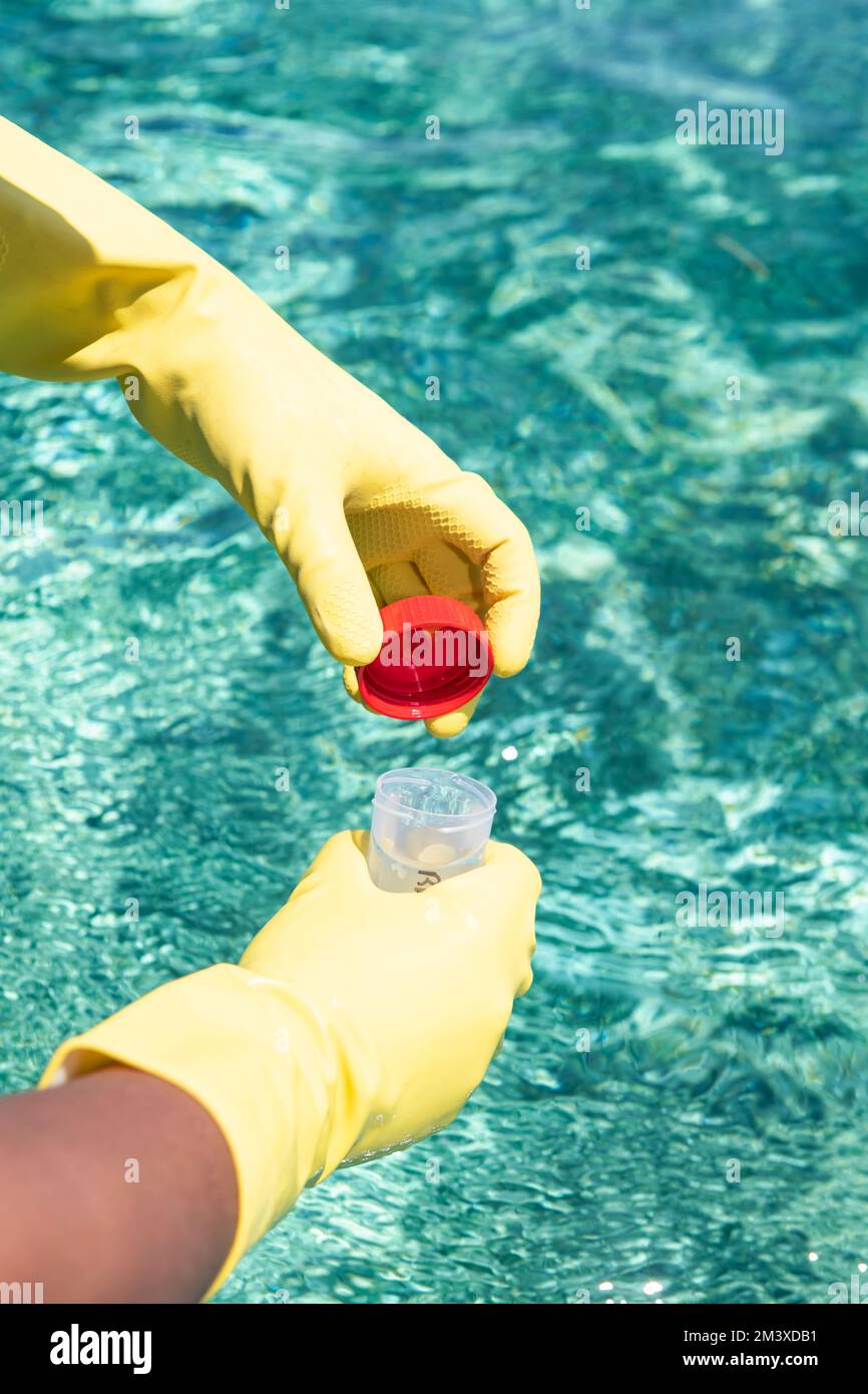 Marine Biologist taking samples of water from a boat for water quality