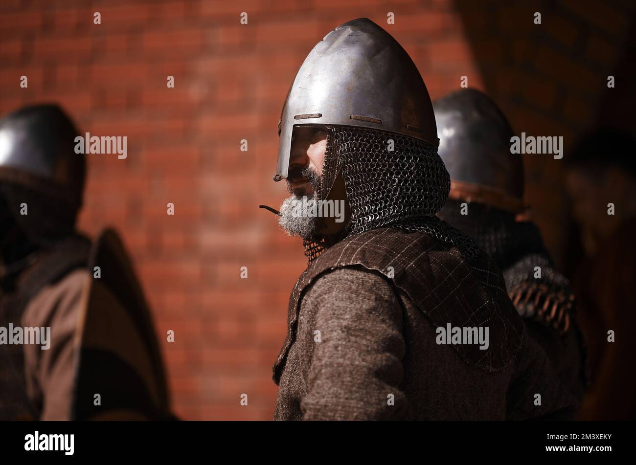 Warrior in helmet in medieval dress. Warrior of medieval Europe