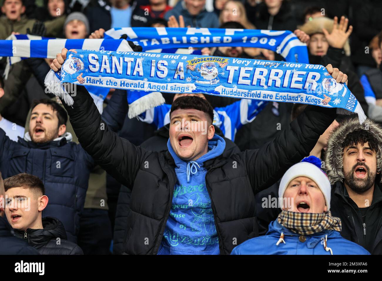 Huddersfield fans holding a scarf up during the Sky Bet Championship