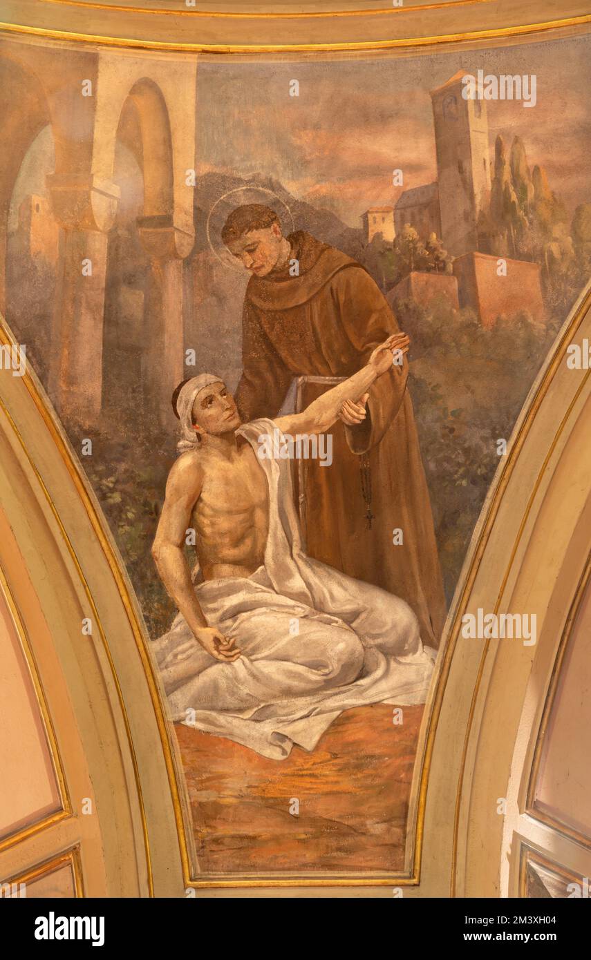 VARALLO, ITALY - JULY 17, 2022: The fresco of St. Anthony of Padua raises a man from the death in the church  Chiesa di sant Antonio by C. Secchi Stock Photo