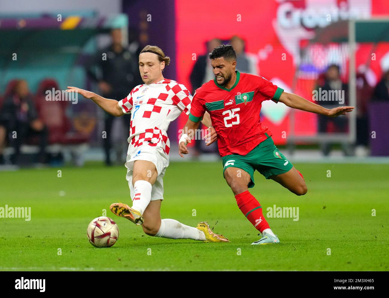 Croatia's Lovro Majer (left) and Morocco's Yahya Attiat-Allah battle for the ball during the FIFA World Cup third place play-off match at the Khalifa International Stadium, Doha. Picture date: Saturday December 17, 2022. Stock Photo