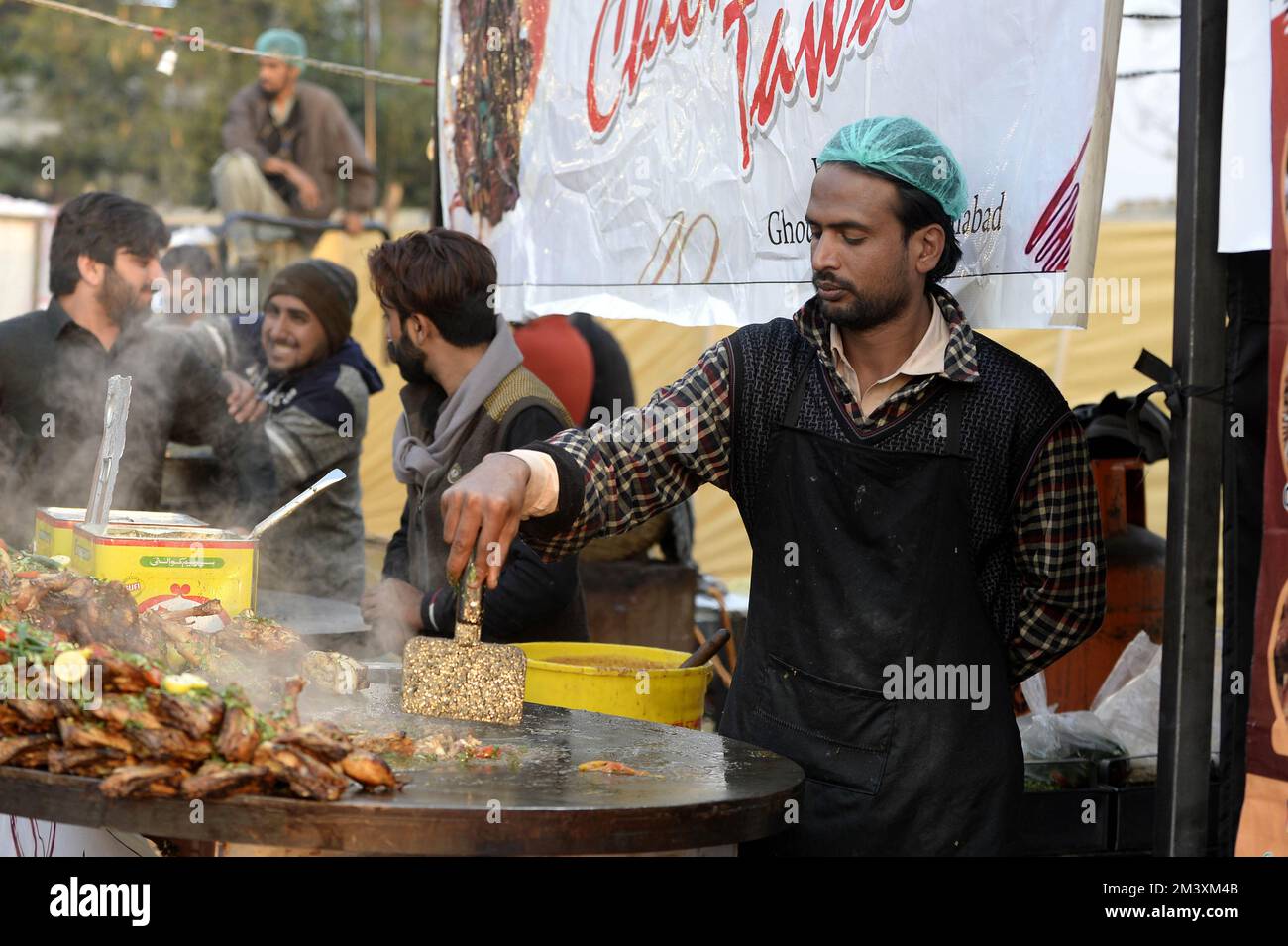 Islamabad. 17th Dec, 2022. A chef cooks during a food festival in