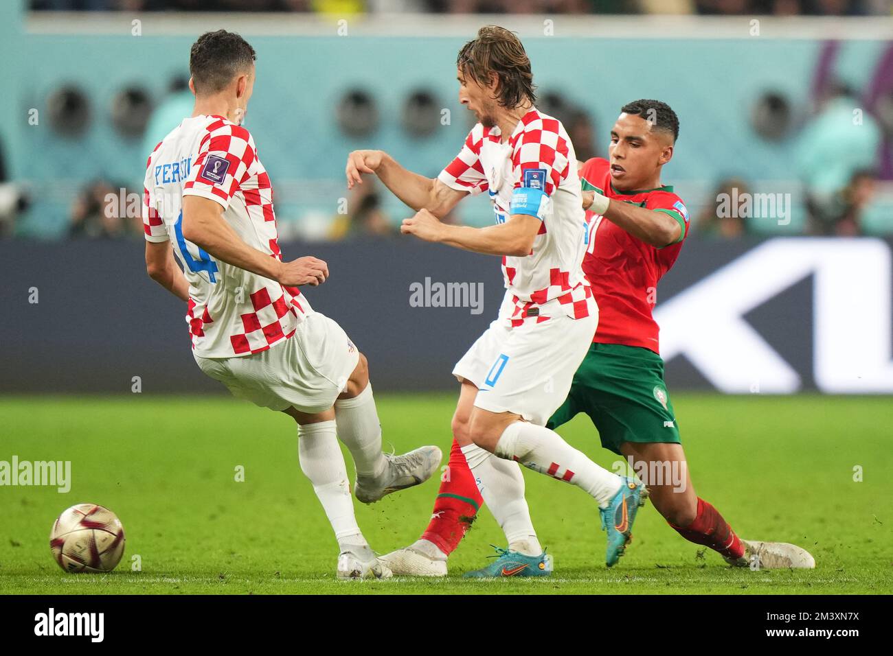 Luka Modric and Ivan Perisic of Croatia and Abdelhamid Sabiriof Morocco during the FIFA World Cup Qatar 2022 match, Play-off fort third place, between Japan and Spain played at Khalifa International  Stadium on Dec 17, 2022 in Doha, Qatar. (Photo by Bagu Blanco / PRESSIN) Stock Photo