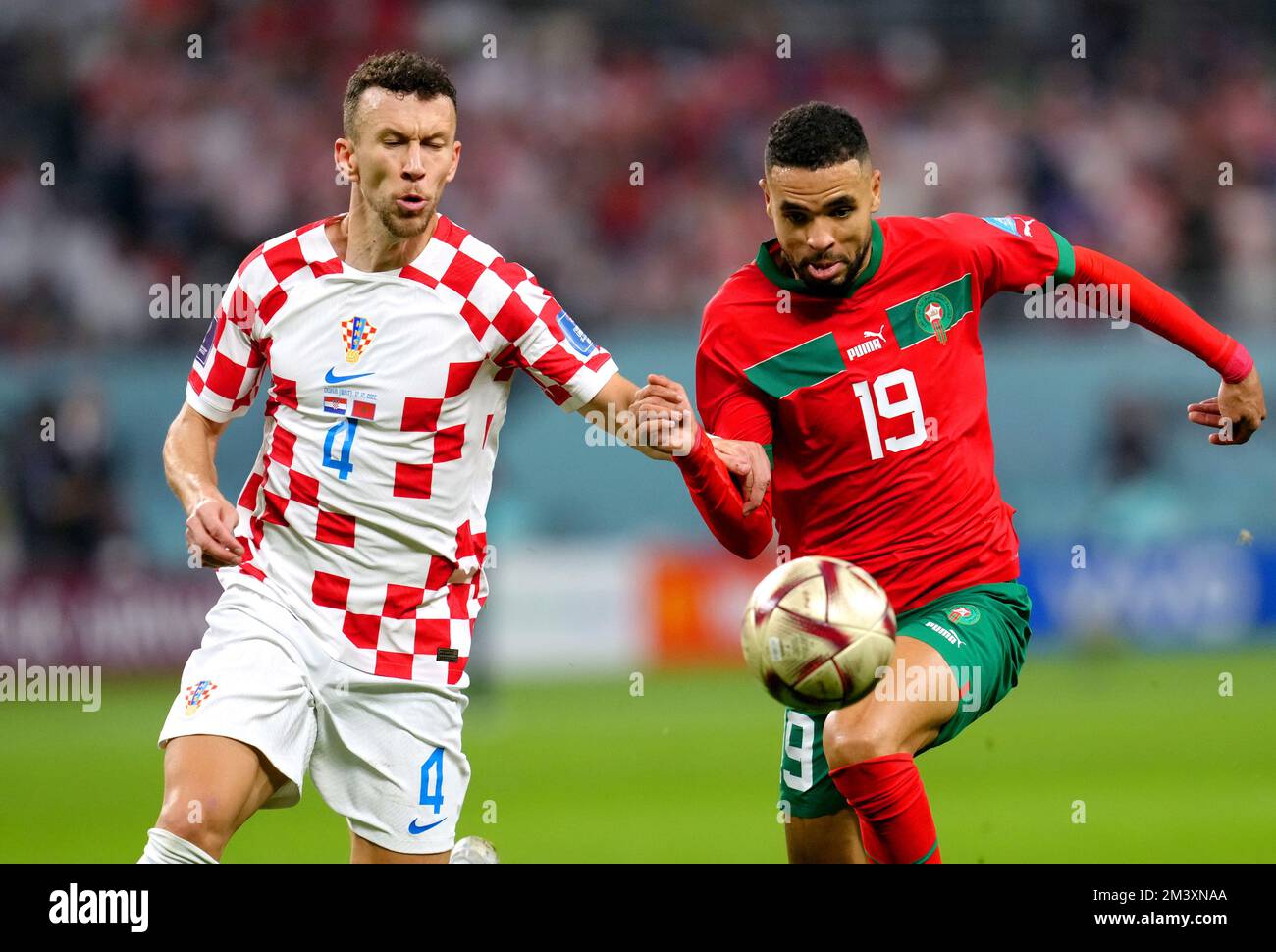 Croatia's Ivan Perisic (left) and Morocco's Youssef En-Nesyri battle for the ball during the FIFA World Cup third place play-off match at the Khalifa International Stadium, Doha. Picture date: Saturday December 17, 2022. Stock Photo