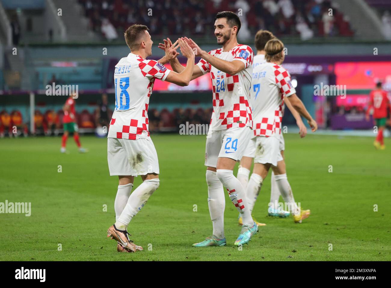Doha, Qatar. 17th Dec, 2022. Mislav Orsic of Croatia celebrates scoring a goal with Josip Sutalo of Croatia during the FIFA World Cup Qatar 2022 3rd place play-off match between Croatia and Morocco at Khalifa International Stadium, Doha, Qatar on 17 December 2022. Photo by Peter Dovgan. Editorial use only, license required for commercial use. No use in betting, games or a single club/league/player publications. Credit: UK Sports Pics Ltd/Alamy Live News Stock Photo