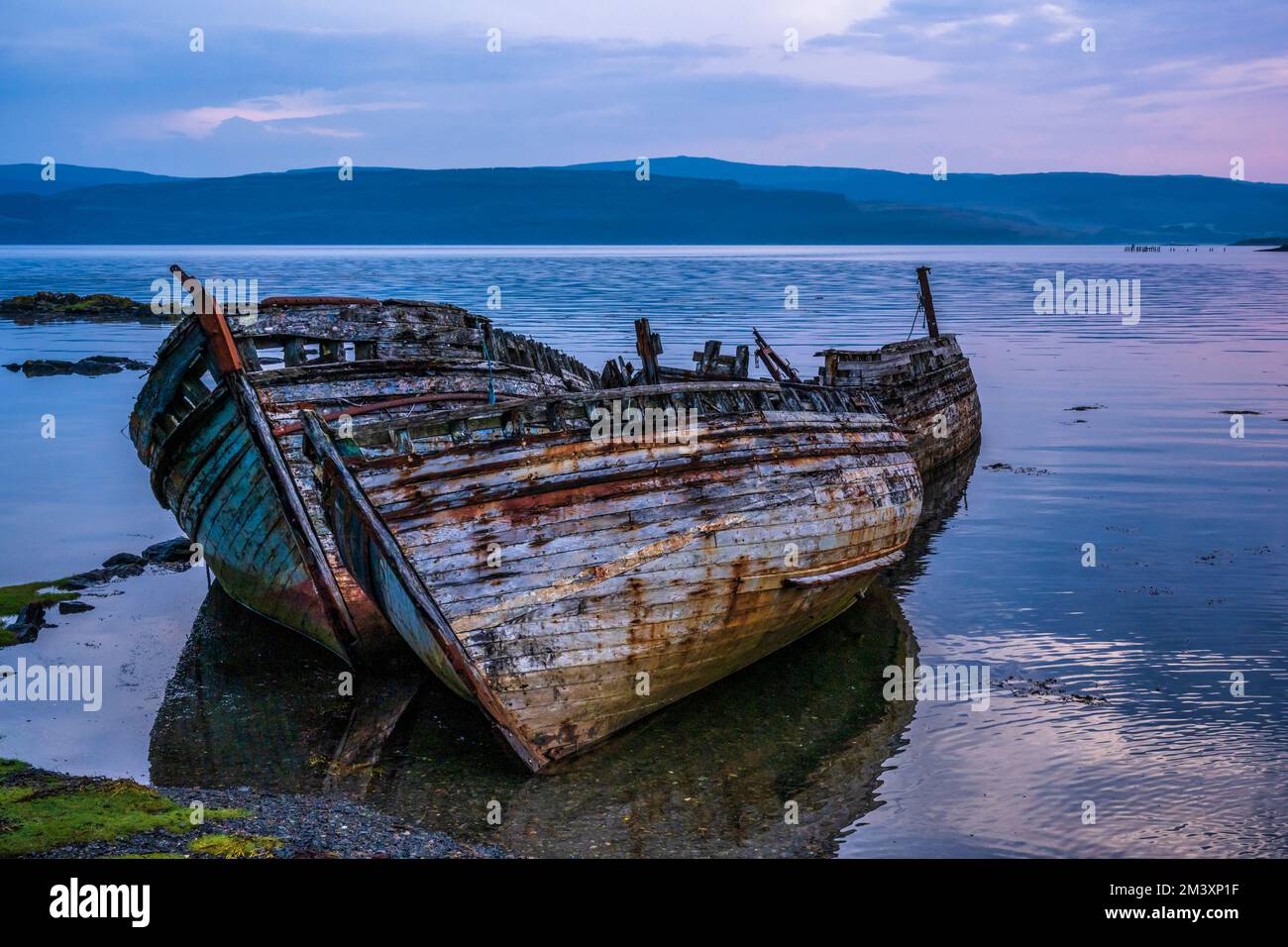 Abandoned fishing boats at Salen Bay at daybreak, Isle of Mull, Scotland, UK Stock Photo