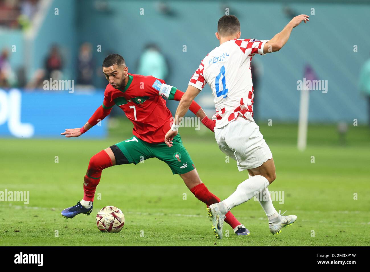 Doha, Qatar. 17th Dec, 2022. Ivan Perisic (R) of Croatia in action with Hakim Ziyech of Morocco during the 2022 FIFA World Cup third place match at Khalifa International Stadium in Doha, Qatar on December 17, 2022. Photo by Chris Brunskill/UPI Credit: UPI/Alamy Live News Stock Photo