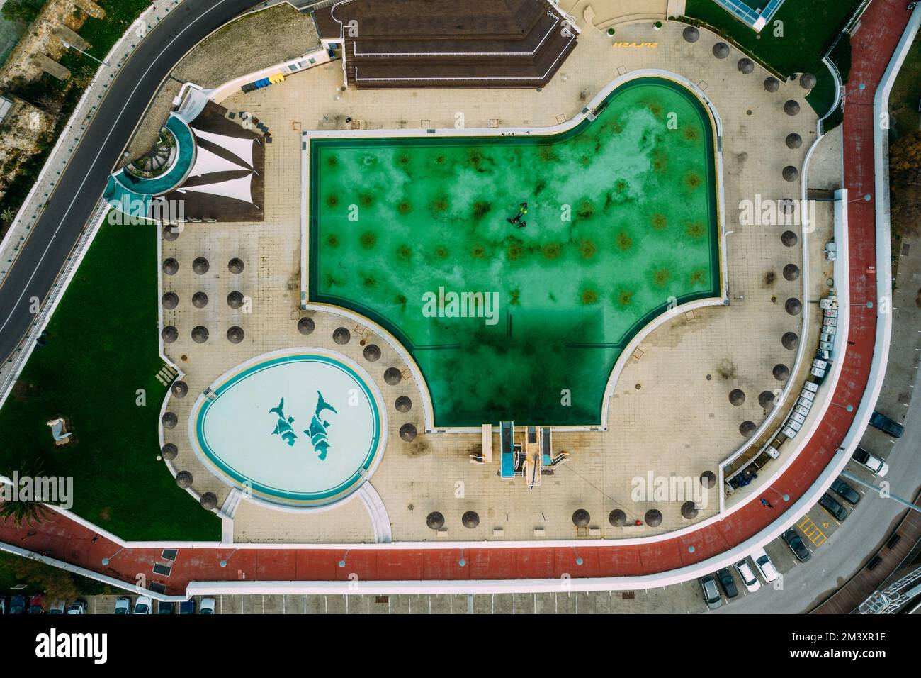 Top down aerial drone view of swimming pool near Oeiras Marina in Lisbon Region, Portugal Stock Photo